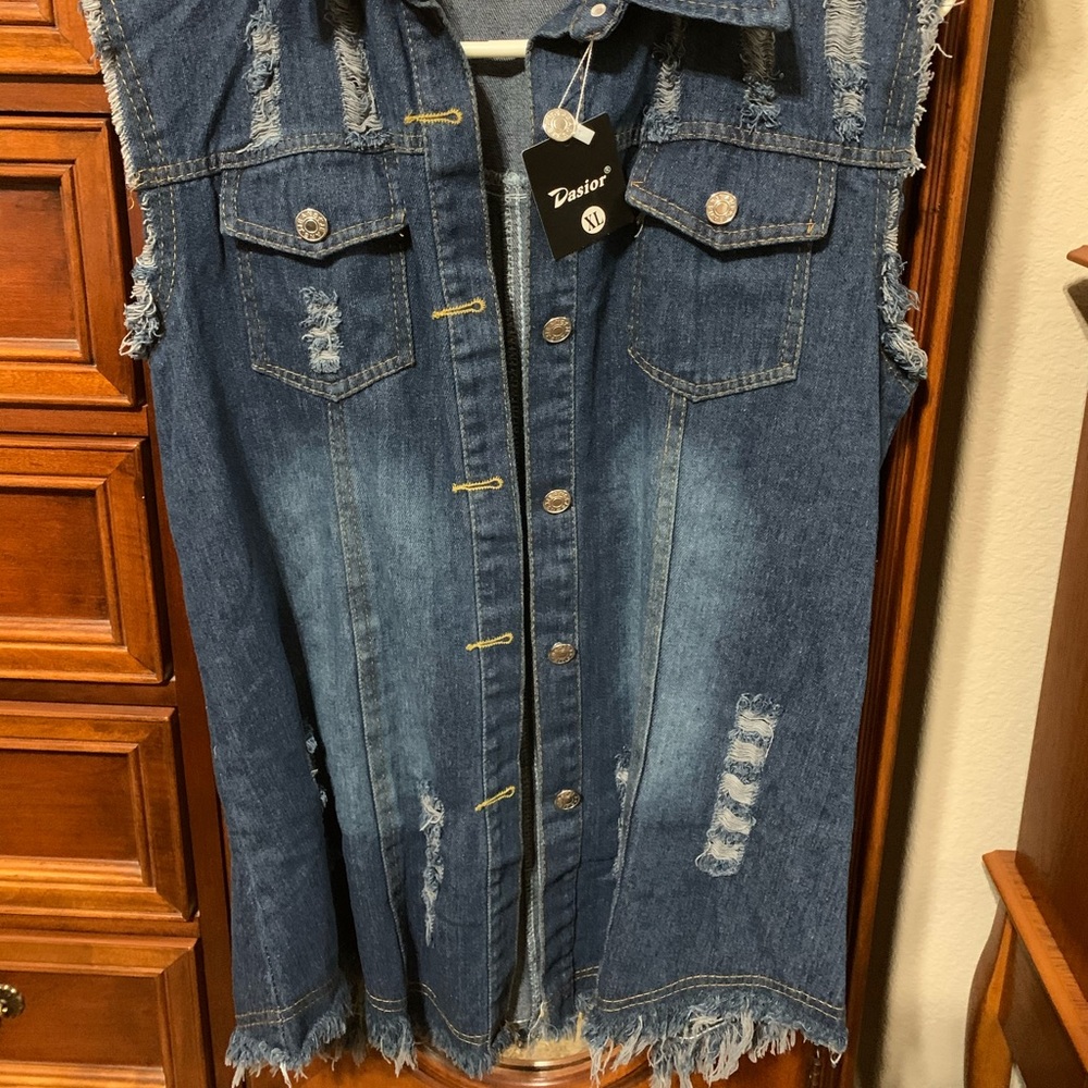 Distressed woman’s jean jacket vest